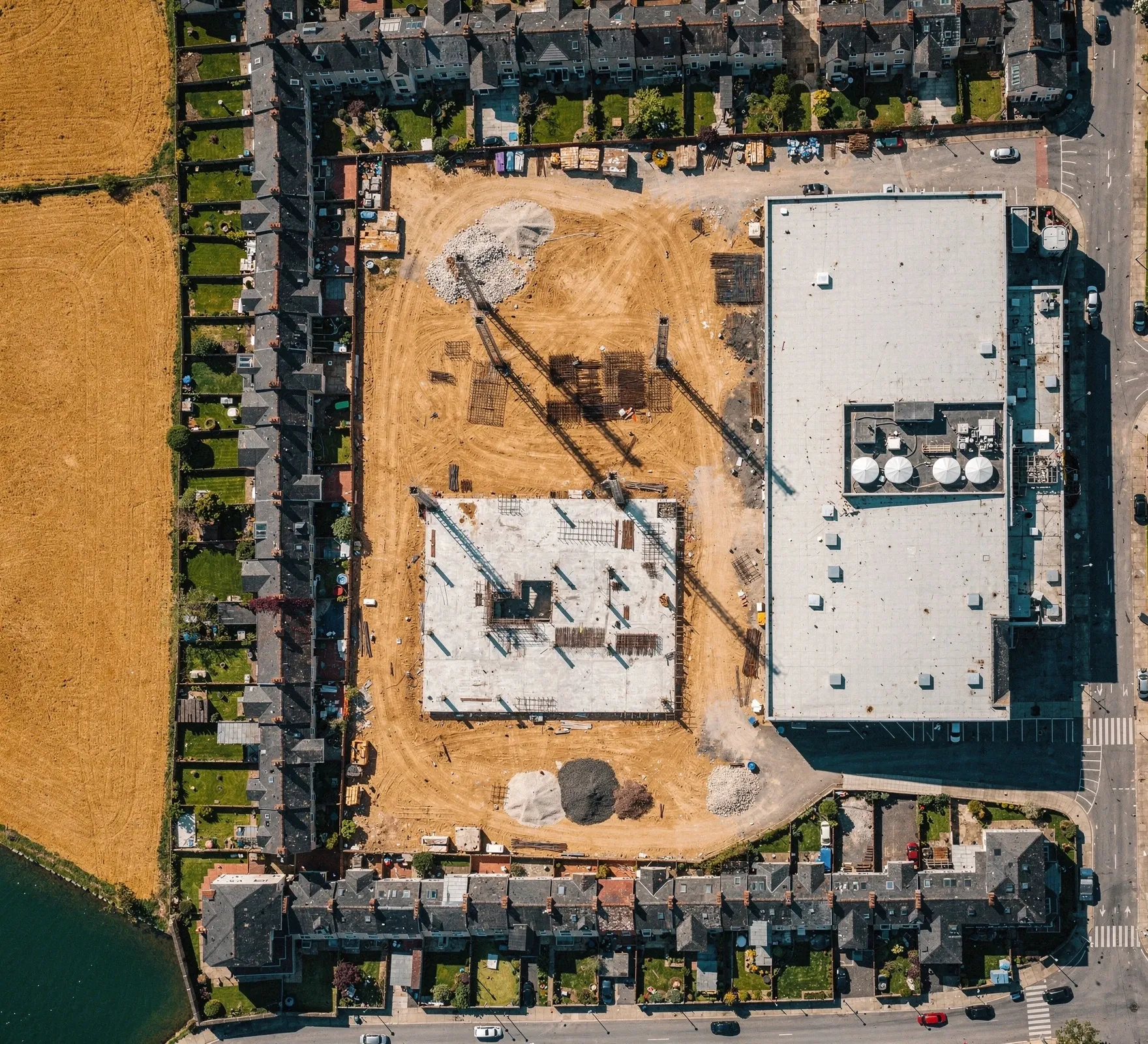 City-edge construction site next to terraced housing